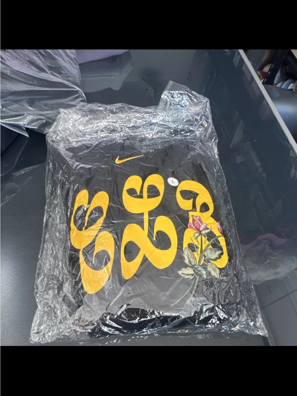 Drake Nike Black Graphic Tee with Yellow Logo and Floral Accent
